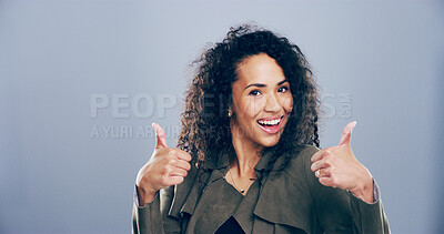 Buy stock photo Woman, portrait or happy with thumbs up in studio for winning announcement, poll agreement or support. Space, person or yes gesture for positive feedback, review praise or approval on gray background