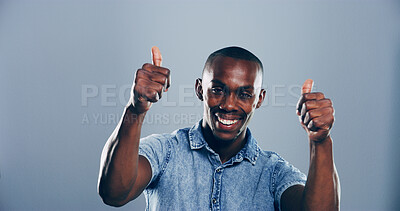 Buy stock photo Happy, black man or portrait with thumbs up for positive feedback or success on a gray studio background. Face, male person or model with smile, like emoji or yes sign for approval on mockup space