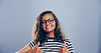 Portrait, thumbs up and woman in studio, icon and agreement on gray background. Face, person and model with hand gesture, space and icon with symbol, perfect and like with emoji, support and review