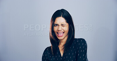 Buy stock photo Woman, wink and smile in studio, space and portrait with pride, confident or sign for attitude by background. Person, model and happy with eye icon, emoji or symbol for secret with flirting in Mexico