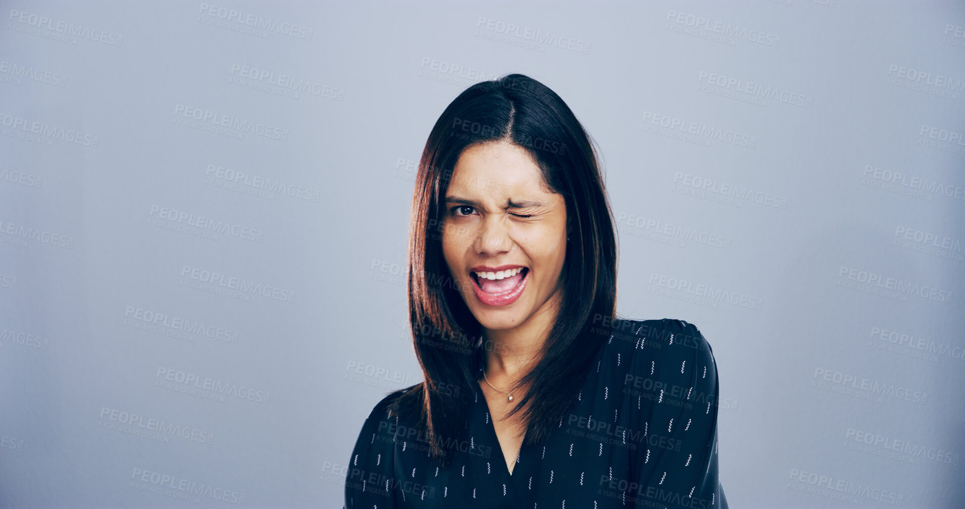 Buy stock photo Woman, wink and smile in studio, space and portrait with pride, confident or sign for attitude by background. Person, model and happy with eye icon, emoji or symbol for secret with flirting in Mexico