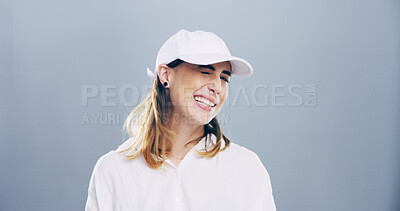 Buy stock photo Portrait, woman and silly with wink in studio, emoji expression and carefree model with flirting. Female person, goofy and confidence with personality for secret, crazy and mockup by gray background