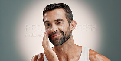 Buy stock photo Skincare, face cream and portrait of happy man in studio for wellness, health and facial hydration. Dermatology, beauty and person smile with lotion, moisturizer and cosmetics on gradient background