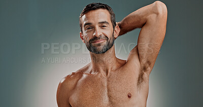 Buy stock photo Portrait, hygiene and man with armpit in studio for natural beauty, grooming or fresh treatment for body odor. Clean, underarm and model with cosmetics, skincare and smile isolated on gray background