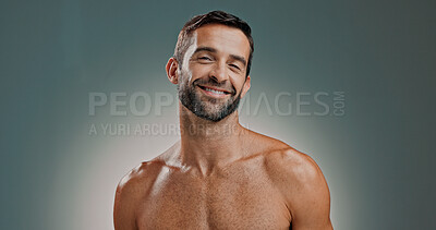 Buy stock photo Portrait, skincare and happy man in studio for natural beauty, shirtless and facial treatment on gray background. Face, cosmetics and male model with confidence for dermatology, glow and aesthetic