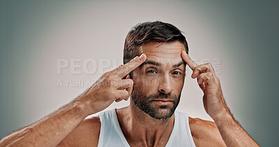 Buy stock photo Skincare, face check and portrait in studio for man, wellness or cosmetics with space for antiaging. Forehead, model and lines inspection for wrinkles, beauty treatment or routine on gray background