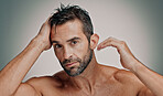 Beauty, hair and cosmetics with portrait of man in studio for cleaning, salon grooming and dermatology. Self care, skincare and aesthetic with person on background for facial and spa treatment
