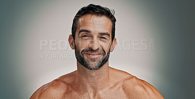 Buy stock photo Smile, skincare and portrait of man in studio for natural beauty, beard and facial treatment. Face, cosmetics and happy male model with dermatology, glow and aesthetic isolated on gray background
