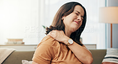 Buy stock photo Shoulder pain, stress and woman on sofa in home with accident, muscle tension and injury in living room. Health, burnout and tired person with medical crisis, inflammation and fatigue in house