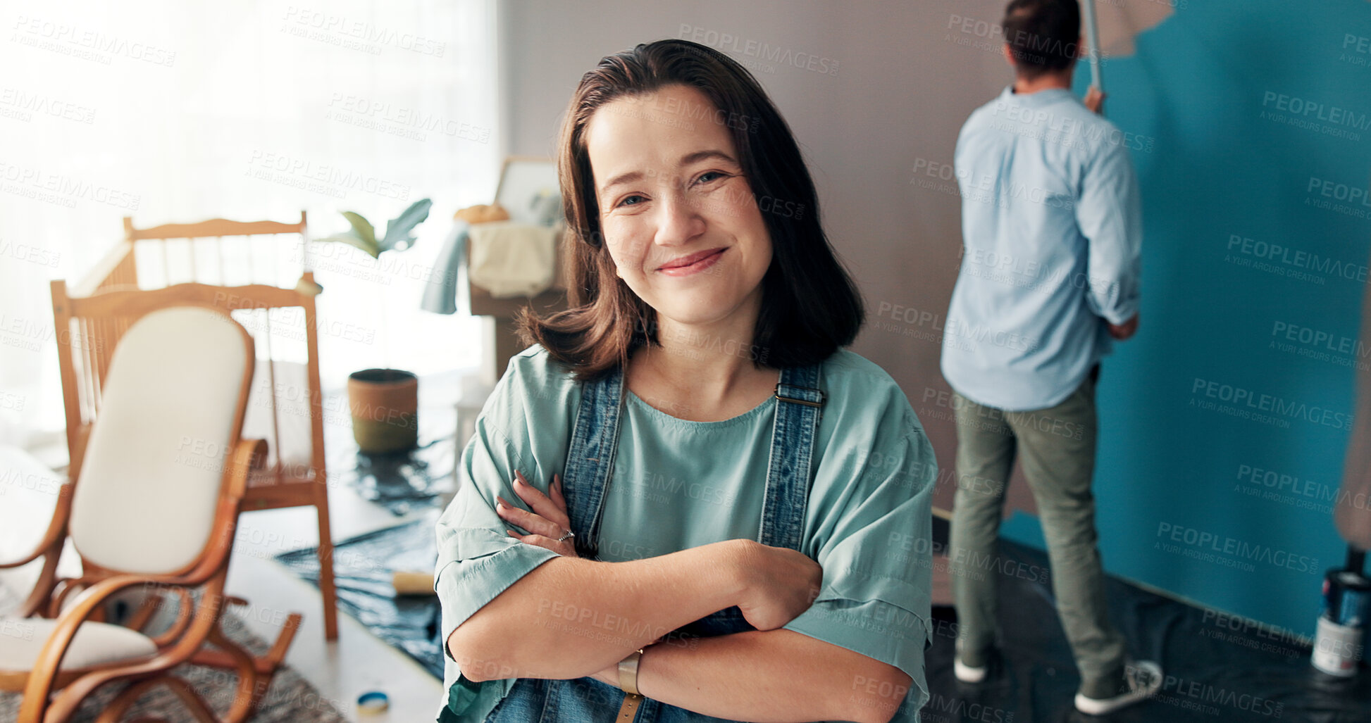 Buy stock photo Portrait, confidence and woman in home for painting, wall decor and renovation with man. DIY, interior design and happy parents with improvement, remodeling and arms crossed for nursery preparation