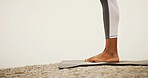 Feet, yoga mat and outdoor on rocks, nature and mock up space for exercise, pilates or wellness in morning. Person, legs and stone for workout, health and training with start for warm up in summer