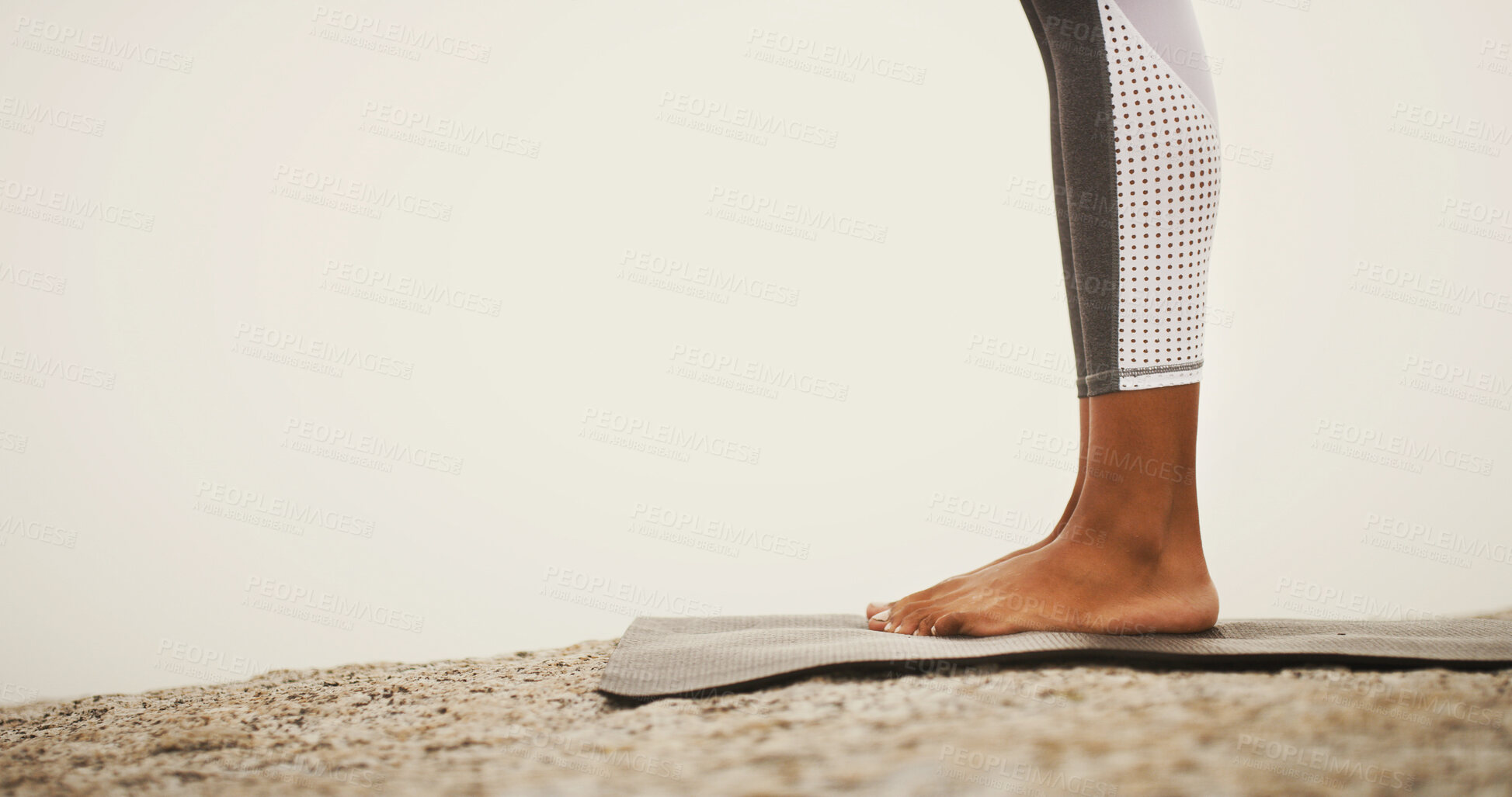 Buy stock photo Feet, yoga mat and outdoor on rocks, nature and mock up space for exercise, pilates or wellness in morning. Person, legs and stone for workout, health and training with start for warm up in summer