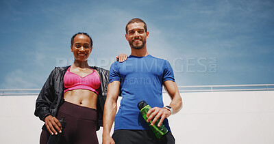 Buy stock photo Couple, happy and fitness with portrait, outdoor and low angle in summer with water bottle, support and break for wellness. Man, woman and smile together with workout, training and exercise in city