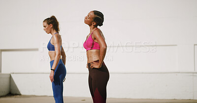 Buy stock photo Fitness, rest and women in city for workout, exercise and marathon training outdoors. Sports, friends and people on break, relax and breath for challenge, performance and wellness in urban town