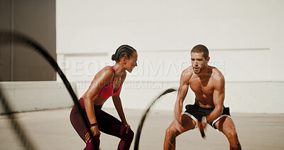 Buy stock photo Woman, man and personal trainer with fitness ropes for muscle growth, motivation and outdoor for exercise. People, coach or mentor with support, workout and resilience for bodybuilding challenge