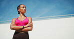 Fitness, woman and arms crossed with break, exercise space and sweat with wellness. Athlete, confidence and blue sky mockup for performance, body goals and outdoors for summer sports and balance