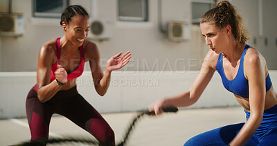 Buy stock photo Fitness, battle ropes and motivation with personal trainer to workout, exercise and wellness. Muscle, woman and bodybuilder with coach for strength, blur or clapping for fast cardio challenge in city