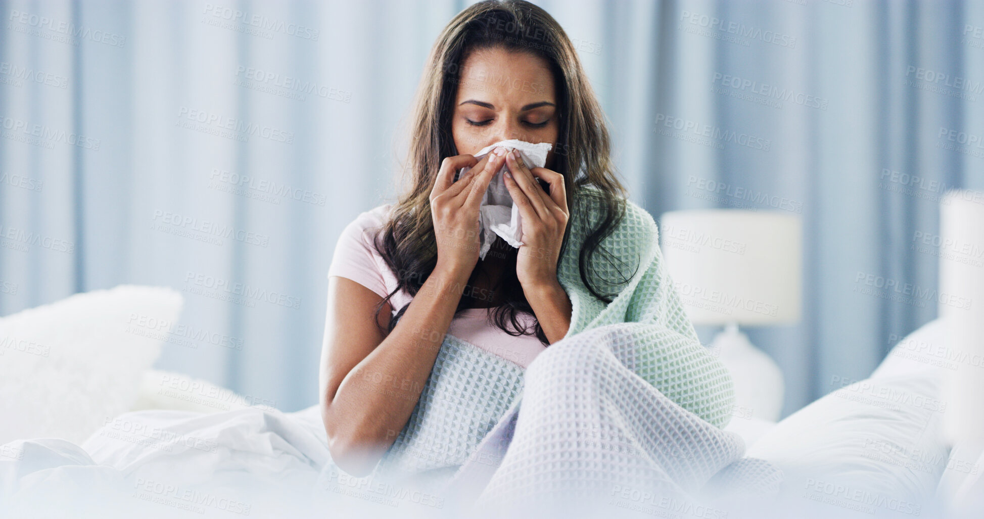 Buy stock photo Woman, tissue and blowing nose in bed with flu, mucus or nasal congestion in morning at house. Girl, toilet paper and cleaning nostrils for hygiene, breathing and sick with inflammation at apartment