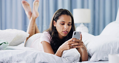Buy stock photo Relax, text and phone with woman in bedroom for online dating, chat forum and social media. Profile view, status update and connection with person at home for networking, communication and search