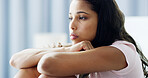 Girl, bedroom and sad with thinking, anxiety and reflection with depression in morning at apartment. Woman, person and wake up with insomnia, lonely and worry with stress for mental health in house