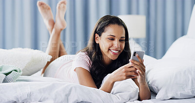 Buy stock photo Relax, happy and phone with woman in bedroom for online dating, chat forum and social media. Profile view, status update and connection with person at home for networking, communication and search