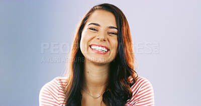 Buy stock photo Happy, laugh and portrait of woman in studio for positive attitude, confidence and pride. Smile, mockup space and isolated person with joy, good mood and excited expression on blue background