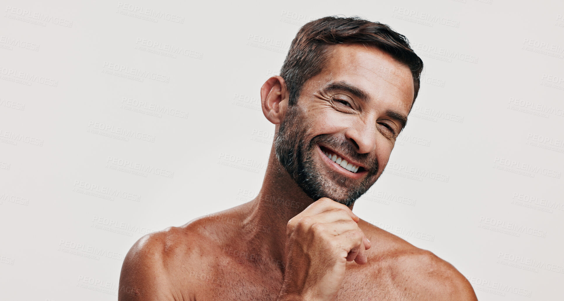 Buy stock photo Portrait, beauty and man for skincare in studio of facial glow,  natural cosmetic and treatment results. Male person, smile and hair growth of grooming routine, dermatology shine and white background
