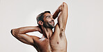 Confidence, flexing and man in studio with body building workout for fitness progress. Mockup space, biceps or proud person with strong arms for power training results or thinking on white background