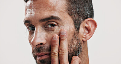 Buy stock photo Portrait, man and lotion for skincare in studio of facial glow, natural cosmetic and treatment results. Person, beauty or collagen cream of grooming hydration, dermatology care and white background