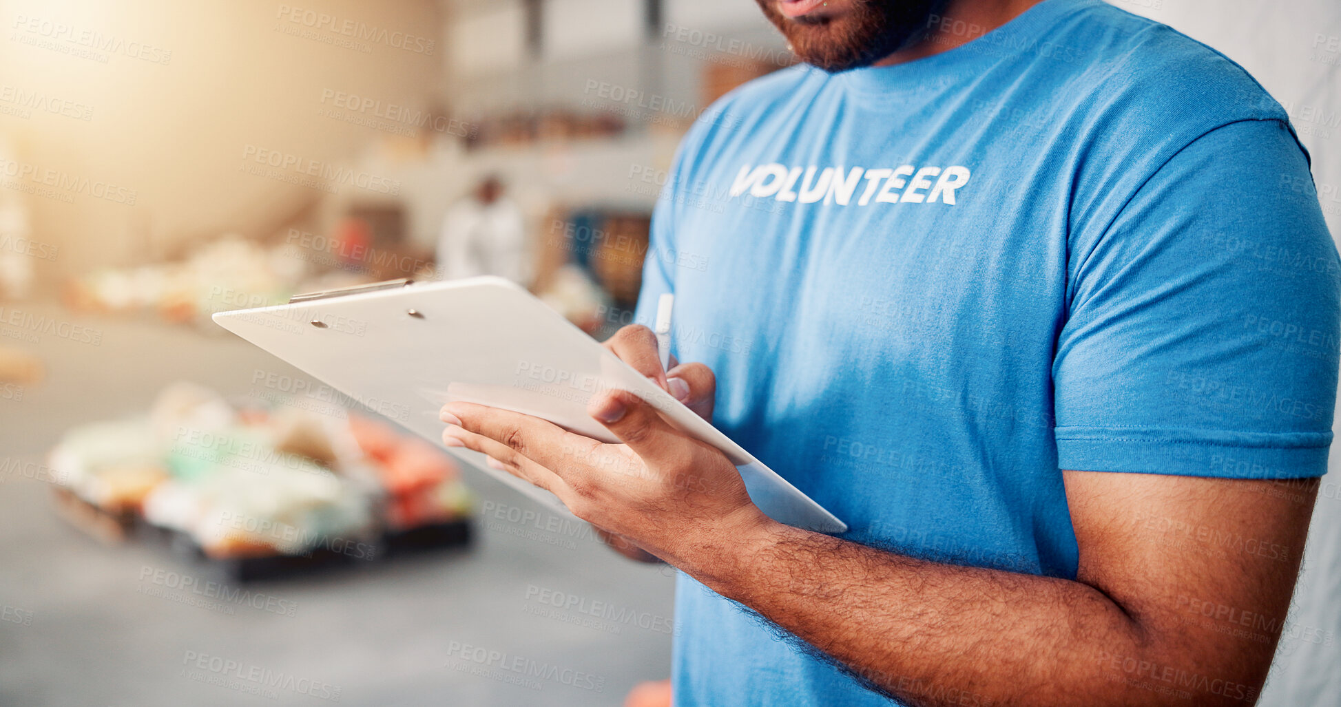 Buy stock photo Checklist, man and hands of volunteer writing for charity, non profit or donation stock in community center. Inspection, clipboard and male NGO worker with inventory for food drive with information.