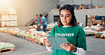 Volunteer, donation and reading with woman in tablet for non profit, inventory checklist and humanity project. Charity, social responsibility and food bank program with person in factory for ngo plan