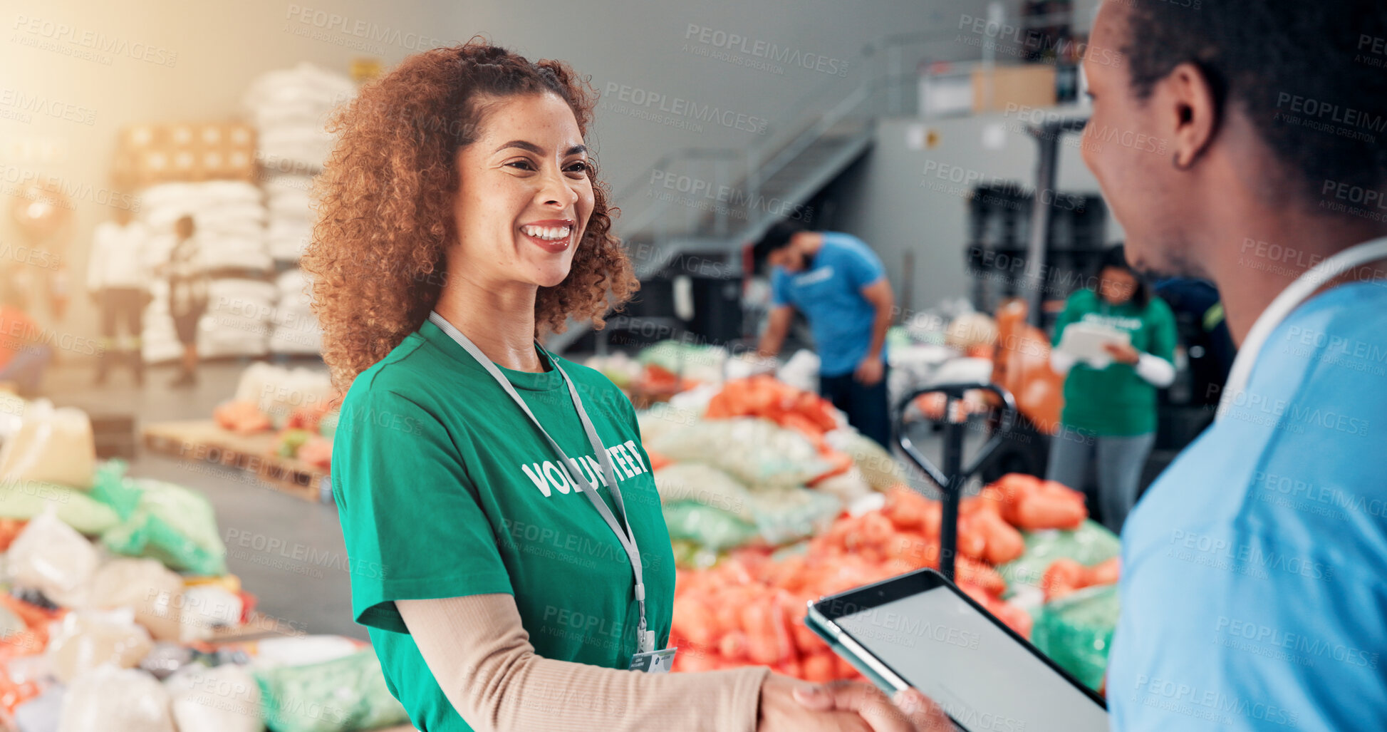 Buy stock photo Handshake, charity and volunteers for community service, people and review of donations on website. Social responsibility, screen and agreement in warehouse with tablet, mockup and smile for teamwork