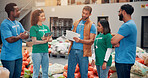 Warehouse, charity and people with clipboard, smile and review of donations on document and discussion. Social responsibility, volunteers and group in factory with food for community service or NGO