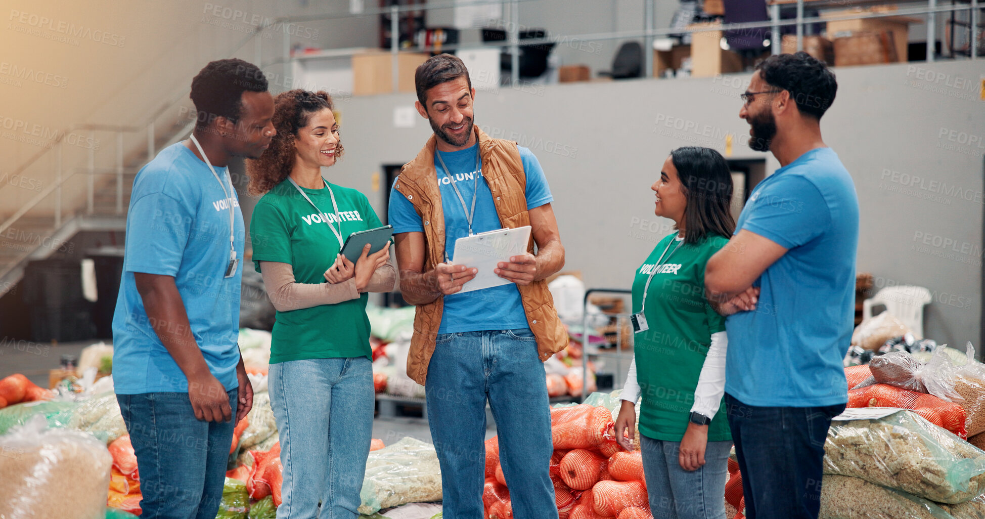 Buy stock photo Teamwork, charity and people with clipboard, smile and review of donations on tablet and inventory. Social responsibility, volunteers and group in warehouse with coordinator for community service
