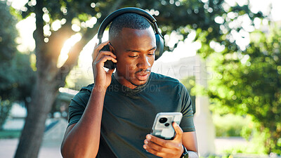 Buy stock photo Nature, black man and fitness with mobile for headphones, podcast and confidence with audio track. Outdoor, male person and runner with music to listen, radio and smartphone with streaming exercise