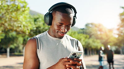 Buy stock photo Outdoor, black man and music with mobile for fitness, training and happy with audio track. Nature, male person and runner with headphones to listen, radio and smartphone with song for exercise