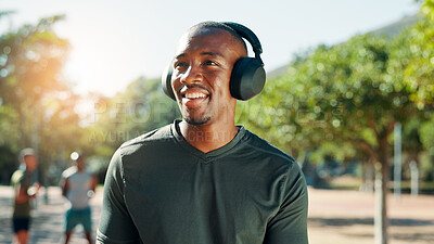 Buy stock photo Fitness, headphones and man outdoor for music, streaming song and thinking of sound. Athlete, smile and listening to radio at park for exercise podcast, audio and motivation playlist on internet