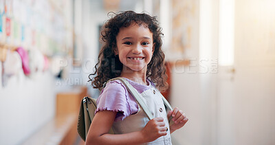 Buy stock photo Happy, backpack and portrait of child in school for learning, development or growth on campus. Pride, kid and face of girl student in hallway for education, studying or lesson at kindergarten academy
