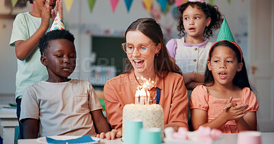 Buy stock photo Teacher, woman and children with birthday cake at school, happy and celebration with snacks in classroom. Person, kids and excited with smile for dessert, cheers and singing for party at academy