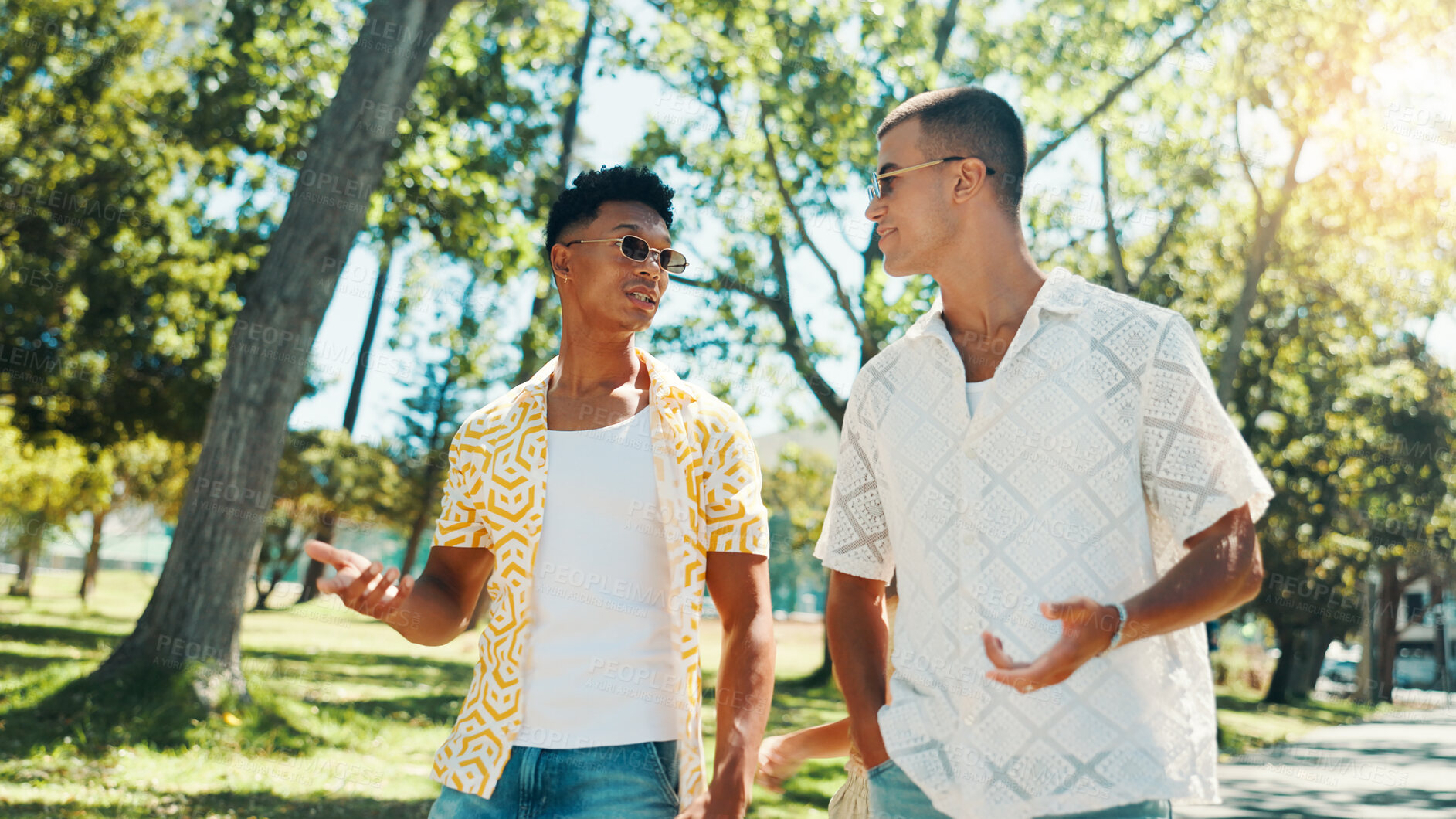 Buy stock photo Men, friends and talking at park for social gathering, university break and bonding together. People, discussion and walking with streetwear clothes of summer holiday, travel journey and reunion trip