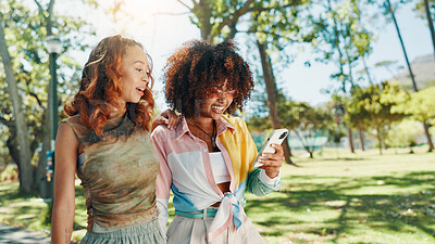 Buy stock photo Phone, girl friends and happy at park for social media post, online blog and reading text message. Mobile, gen z women and outdoor together for internet gossip, communication and show video on app