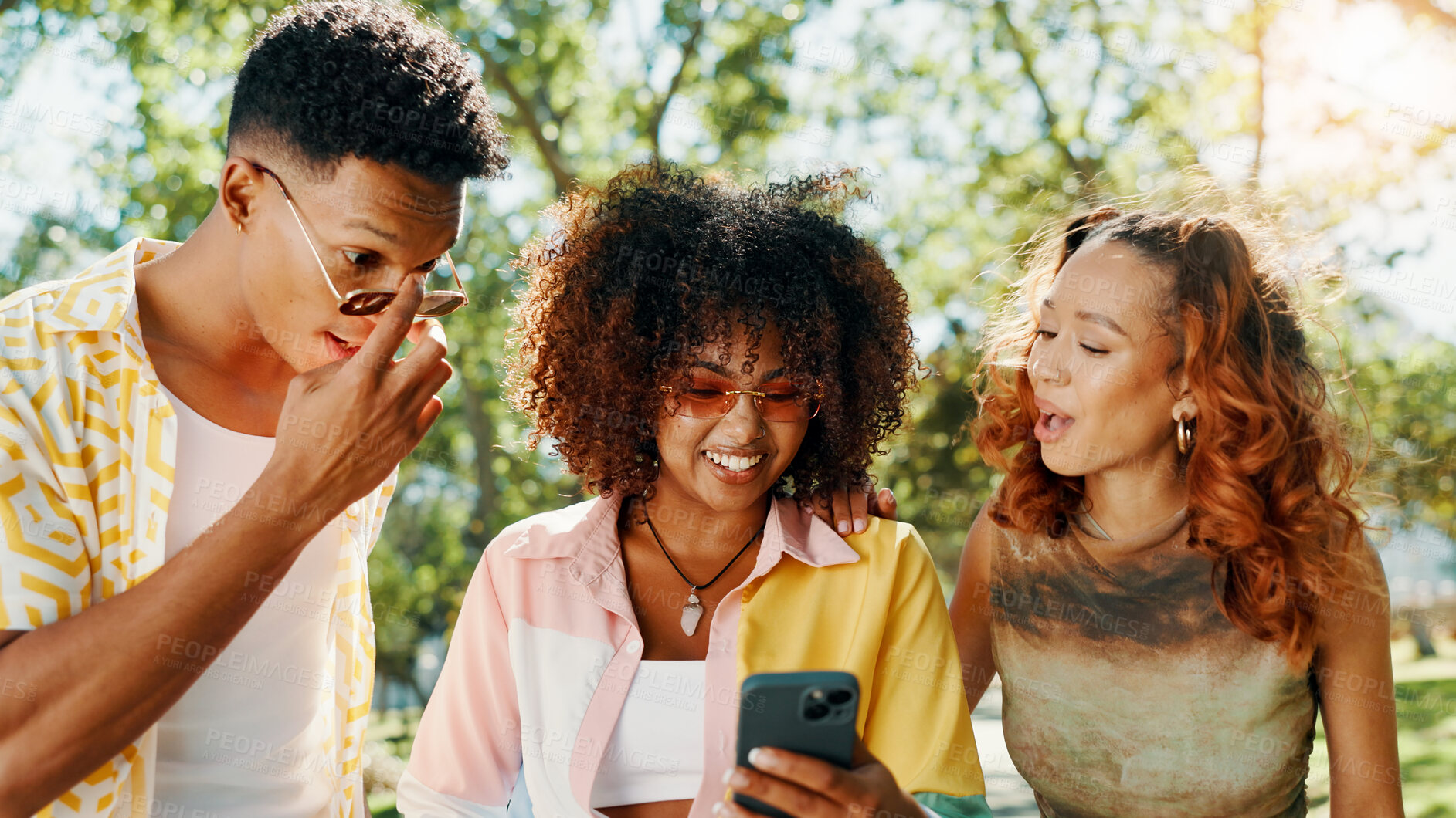 Buy stock photo Friends, online and surprised with phone at park for social media update, gossip post and drama news. Gen z people, shocked and smartphone with reading information, announcement or chat notification