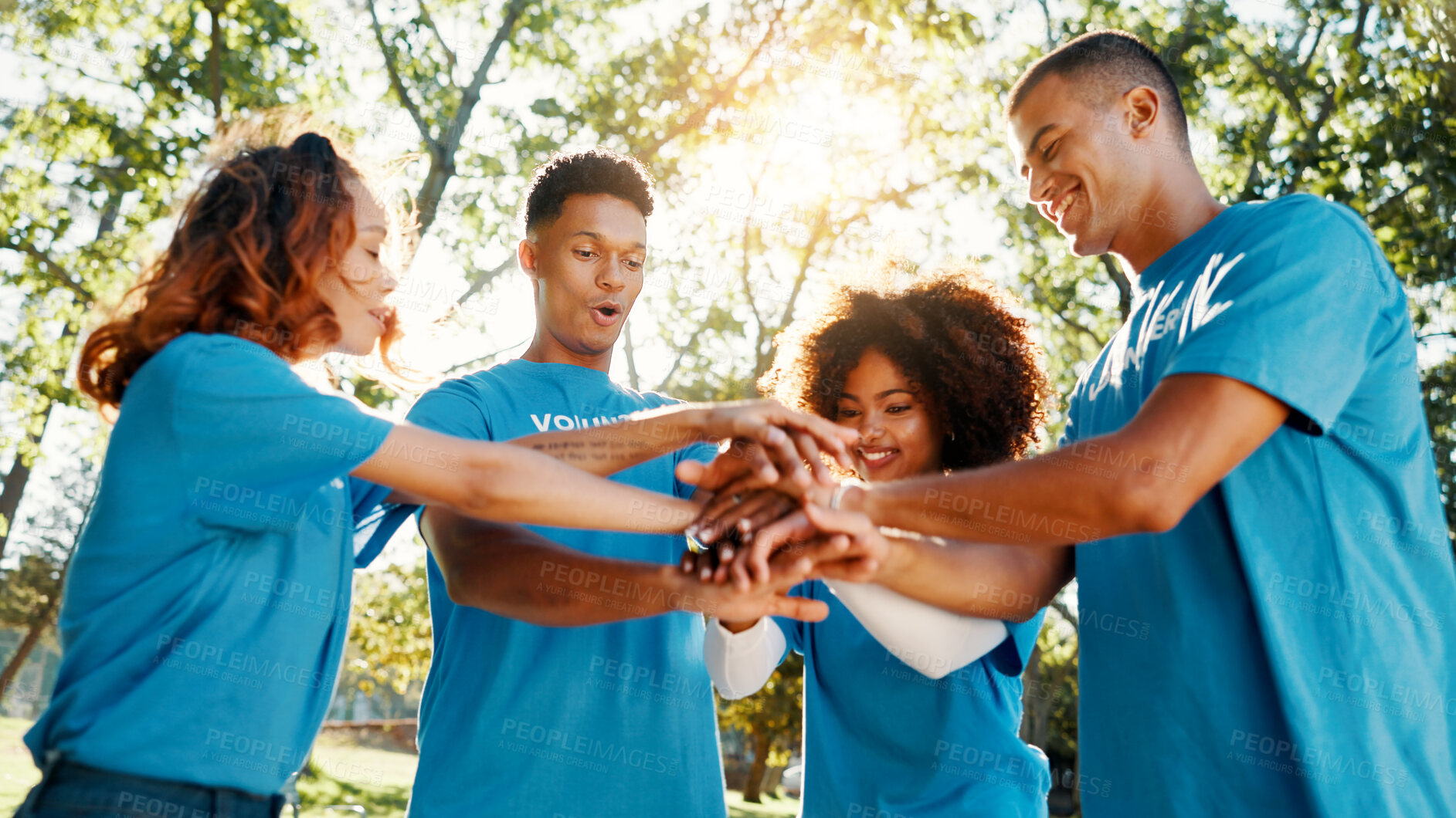 Buy stock photo Volunteer, team and people huddle outdoor for support, donation goal or cooperation in low angle. Hands together, community service or group with motivation for NGO, smile or collaboration at charity
