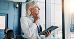 Business, thinking and woman with tablet, window and inflation analyst with problem solving. Mature person, employee or financial advisor in office, tech or decision for stock market, choice or email