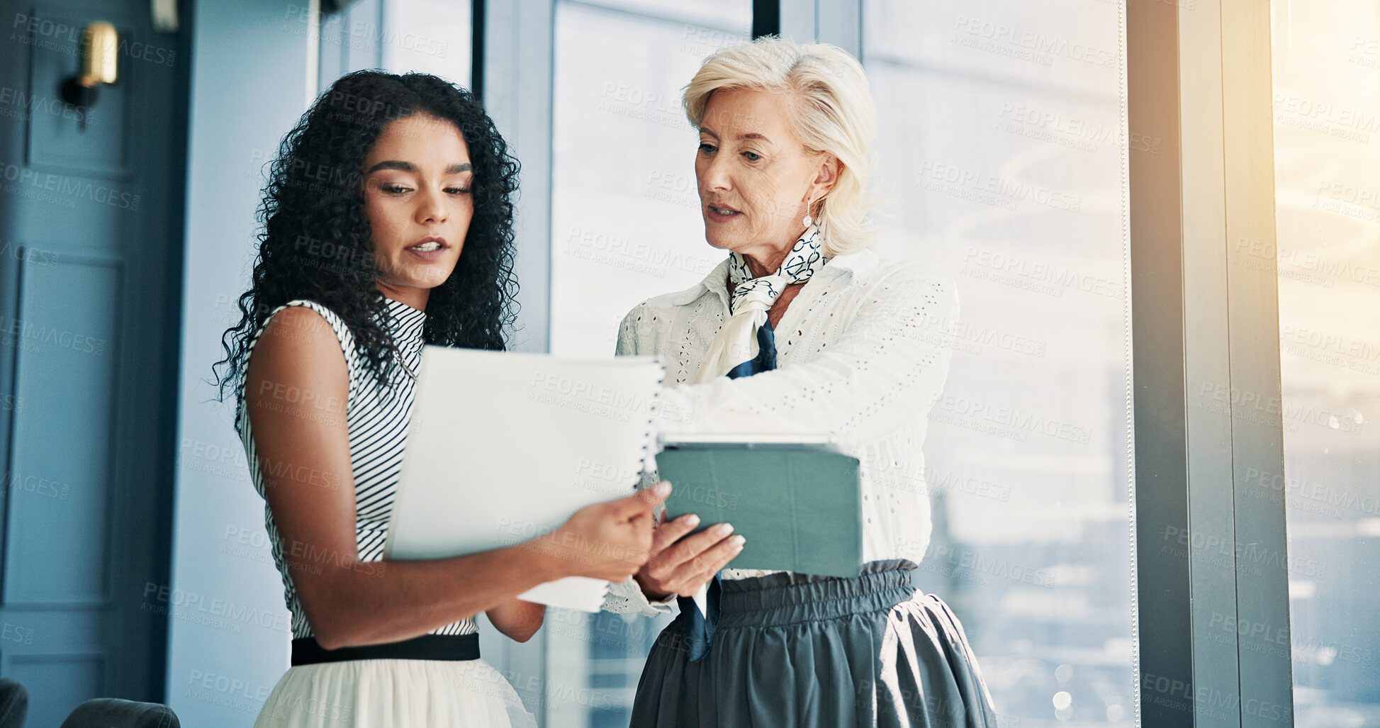 Buy stock photo Women, talk and documents with tablet in office, finance and feedback with report at company. Business people, discussion and app with paperwork for review, check and advice at investment agency