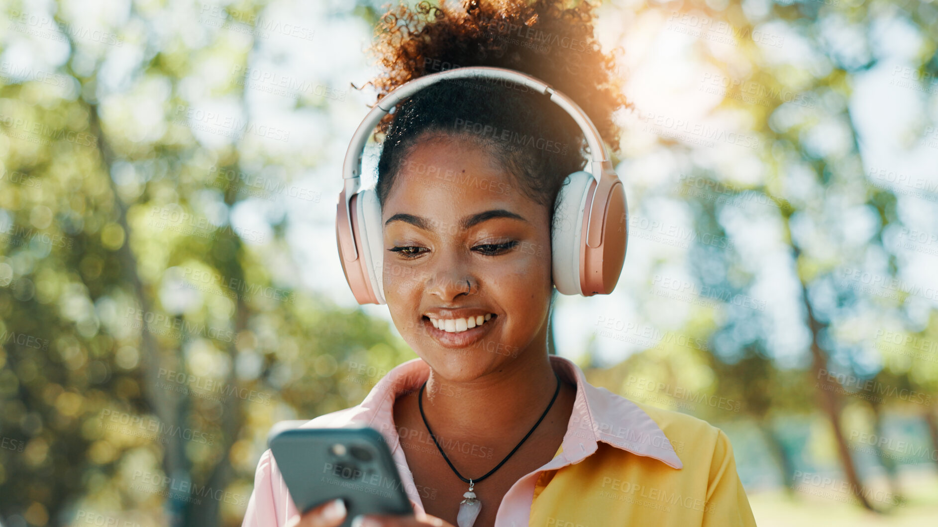 Buy stock photo Park, woman and smile with mobile for music, audio track and check location on vacation outdoor. Nature, African female person and tourist with smartphone for travel application, headphones and happy