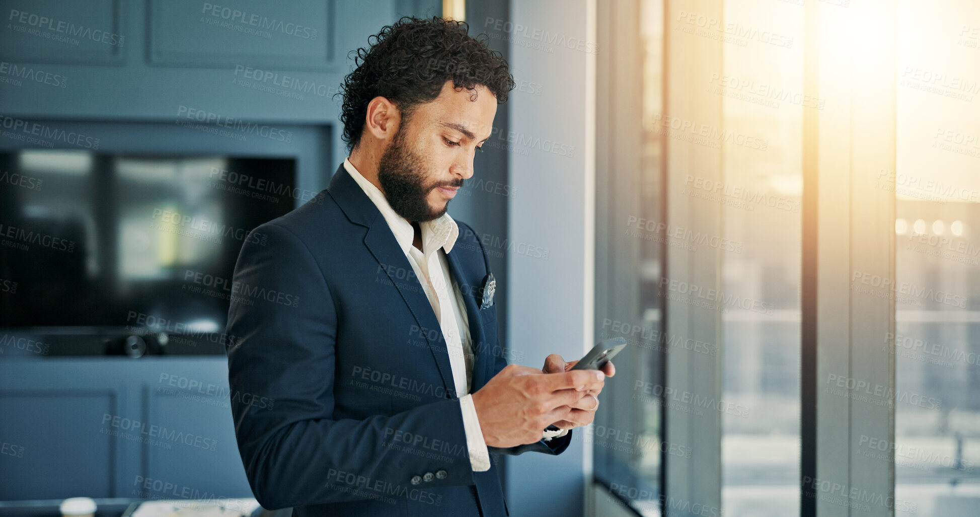 Buy stock photo Phone, research and businessman by window in office for company budget plan with dividend. Cellphone, email and male financial manager with investment proposal for profit or revenue of private client