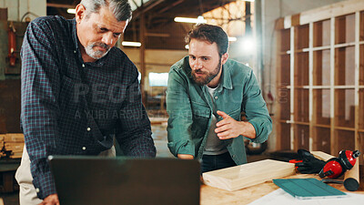Buy stock photo Carpentry, meeting and men in workshop on laptop for furniture, restoration and lumber manufacturing. Construction, computer and carpenters planning with planks, timber and board for renovation