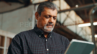 Buy stock photo Business, scroll and man in factory, tablet or carpenter with email for online order. Mature person, employee or tech with checklist for inventory, furniture designer or planning for woodwork project