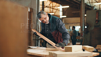 Buy stock photo Carpenter, mature and check wood for construction, furniture or renovation project planning. Woodworker, person and plank with tools in creative carpentry workshop for manufacturing, art and craft
